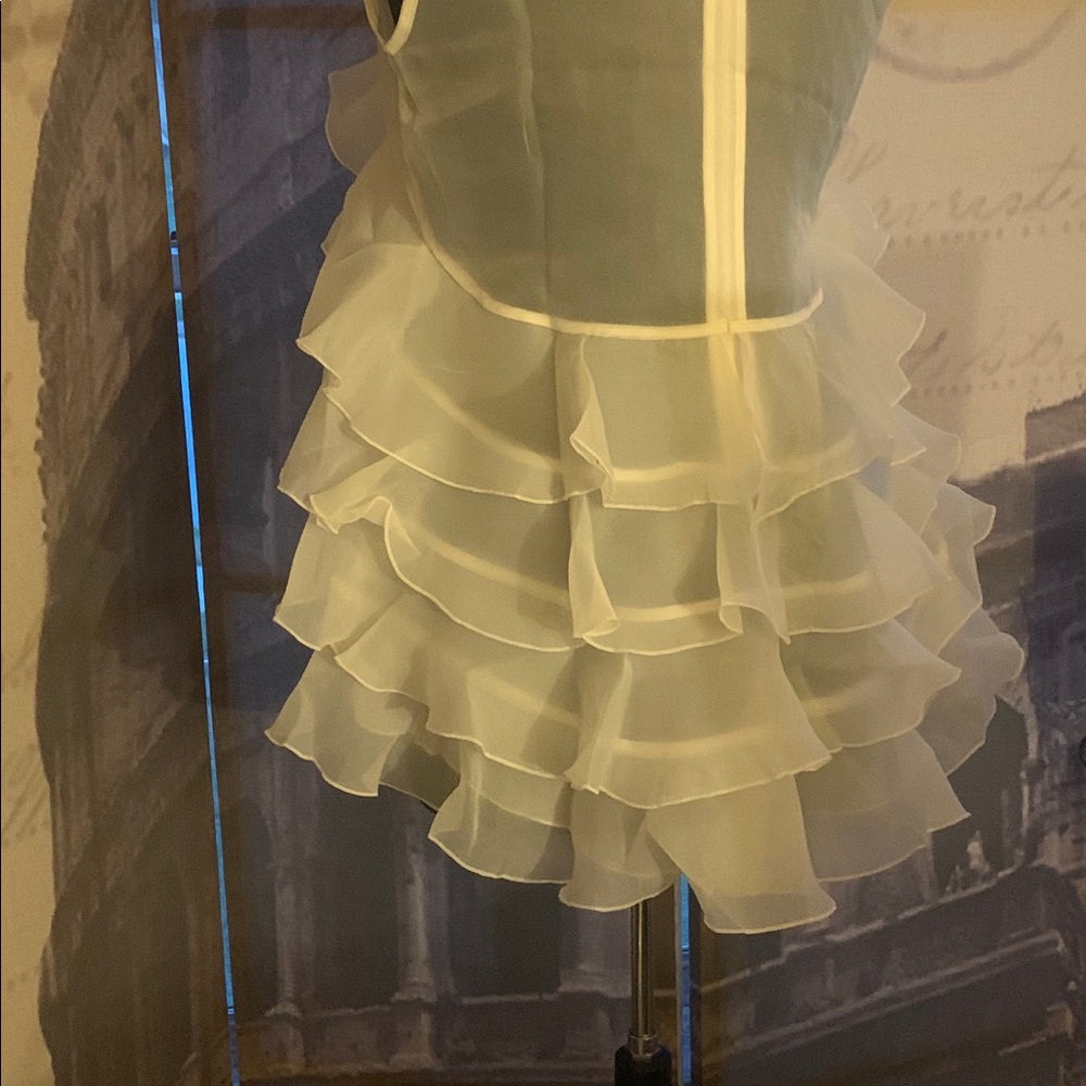 Chiffon ruffled layered white top.